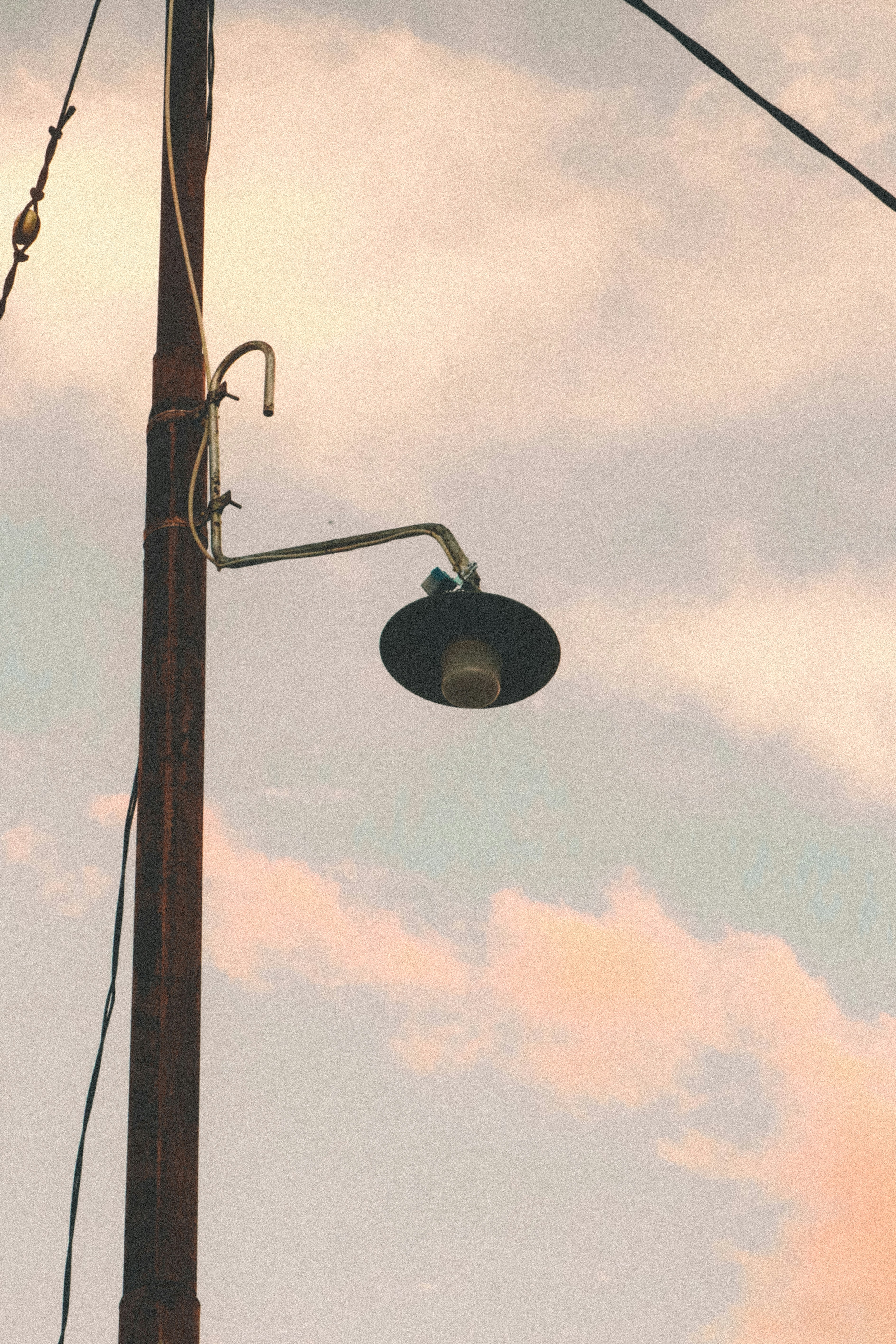 a lamp post with a street light attached to it