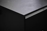 Close-up of freshly polished kitchen countertops with gleaming surfaces.