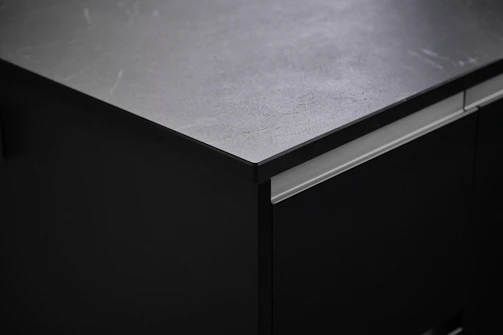 Close-up of a melamine table surface showing its smooth, easy-to-clean finish