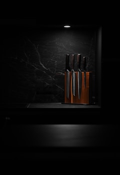 Premium knives arranged elegantly on a black background.
