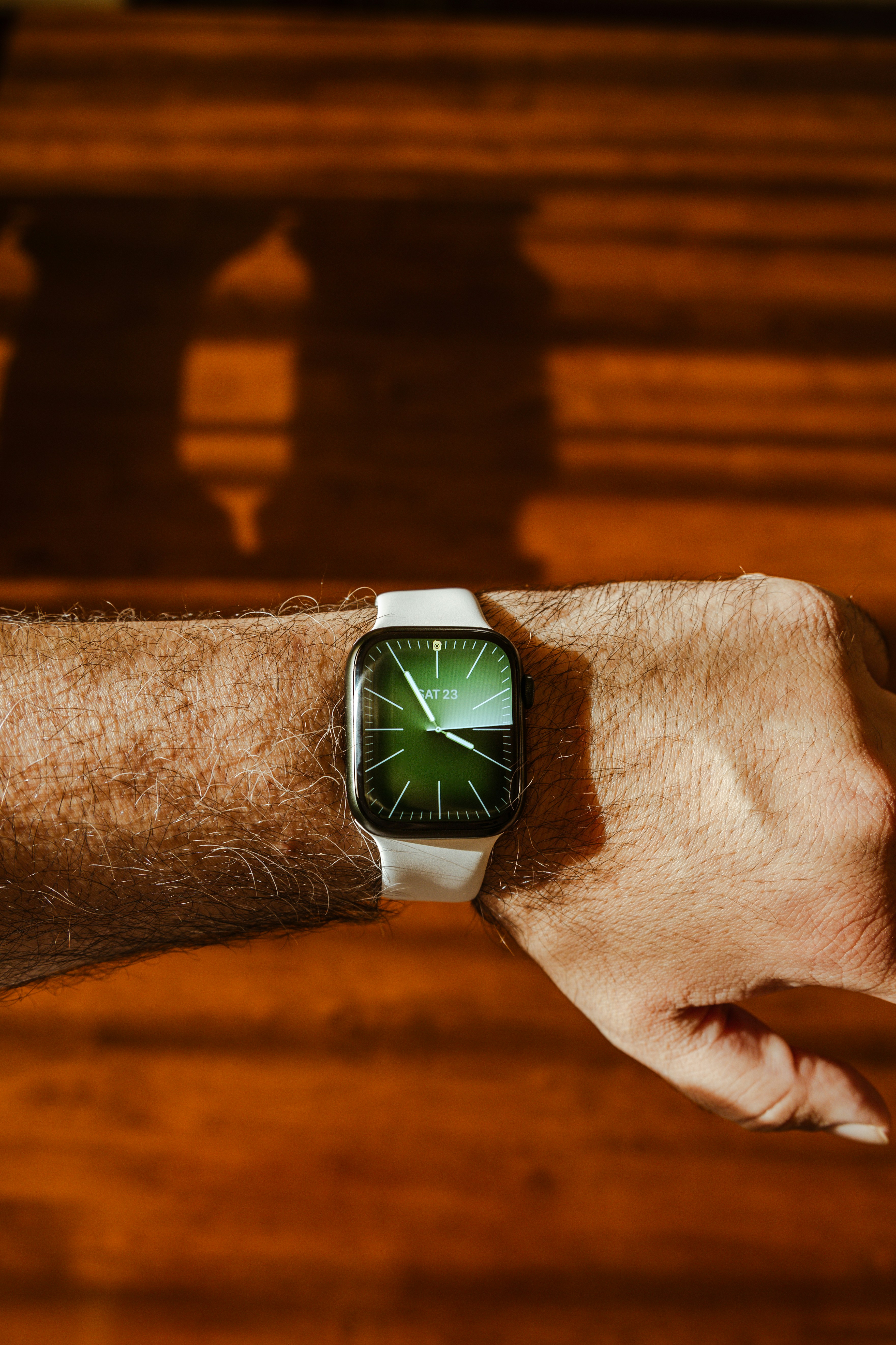 a close up of a person wearing a smart watch