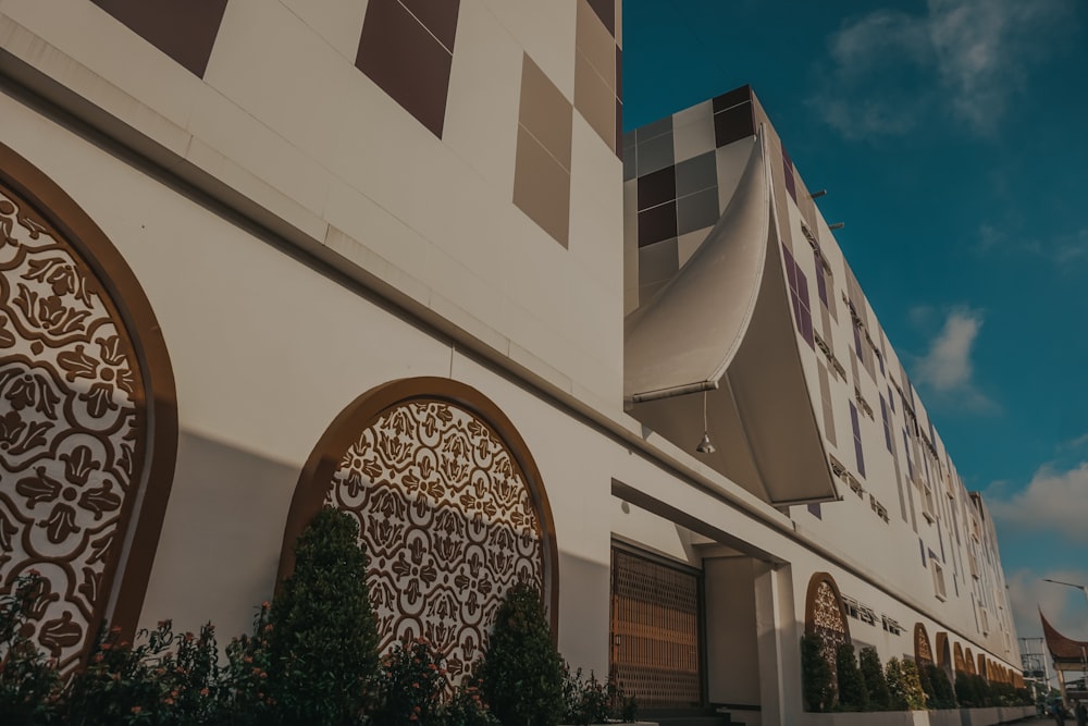 a white building with intricate designs on the side of it