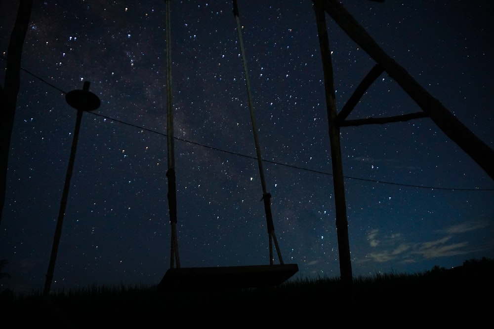 the night sky is full of stars and a telephone pole