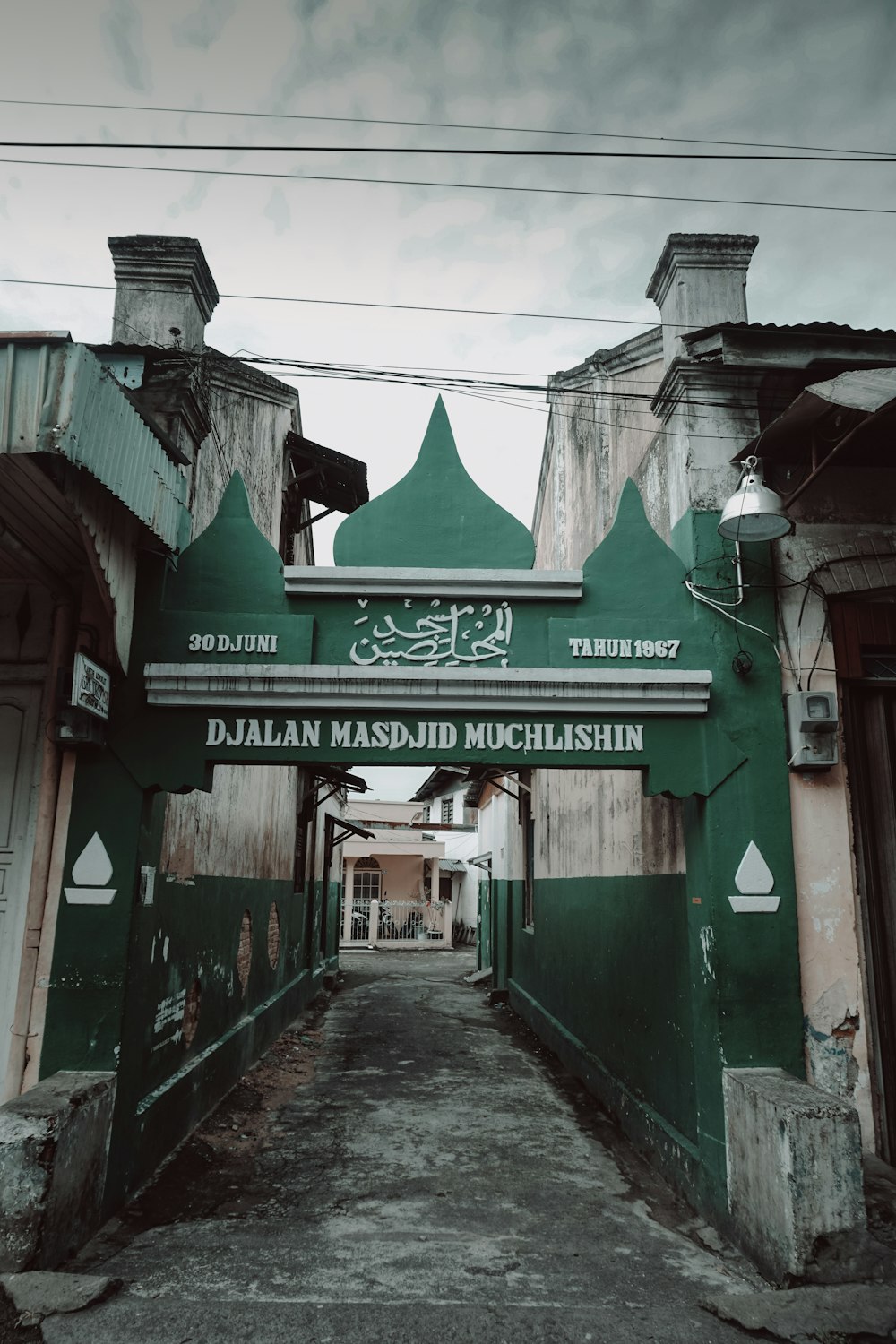 a green and white sign on a building