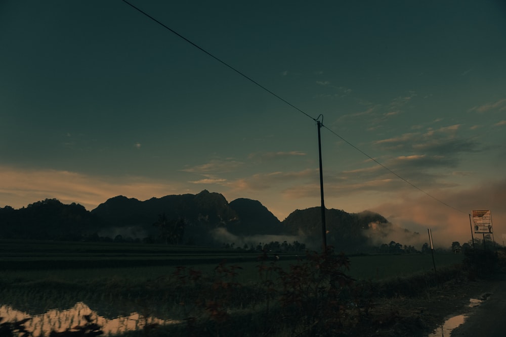 a view of a mountain range at dusk