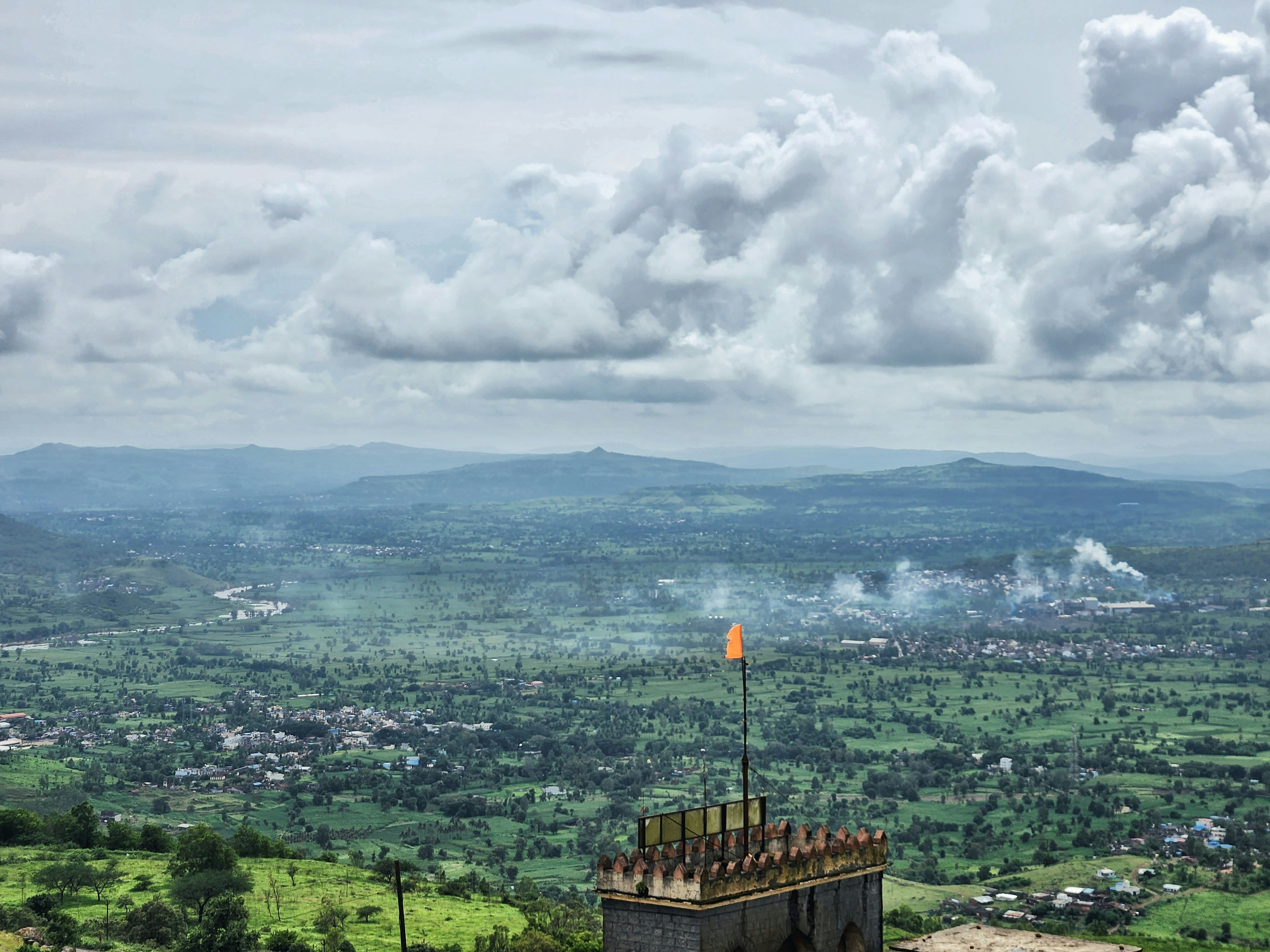 a tower with a flag on top of it