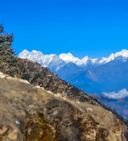 A scenic view of the Andes mountains under a clear blue sky.