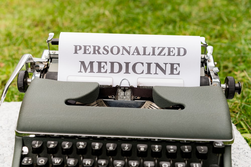 a typewriter with a paper that reads personalized medicine