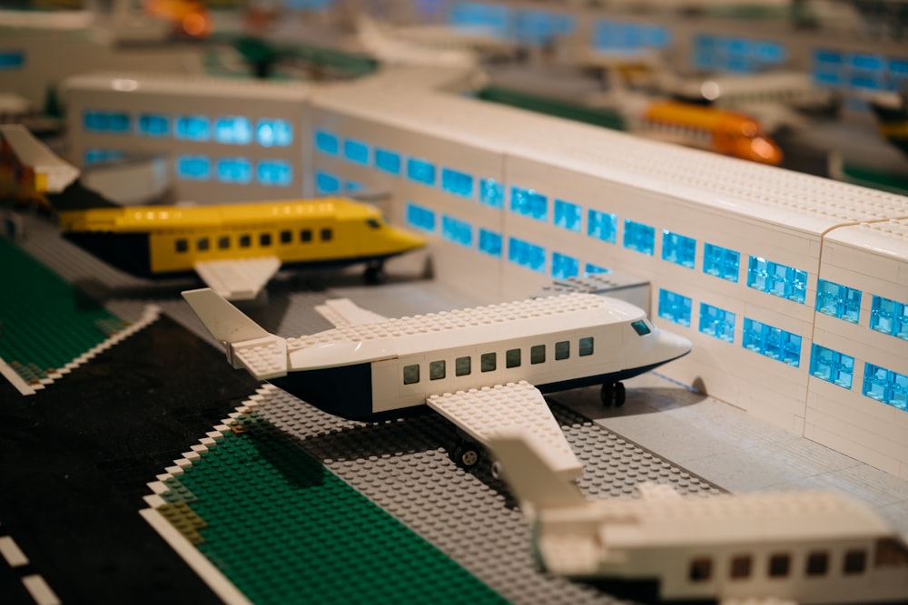 a lego model of a passenger train and a passenger jet