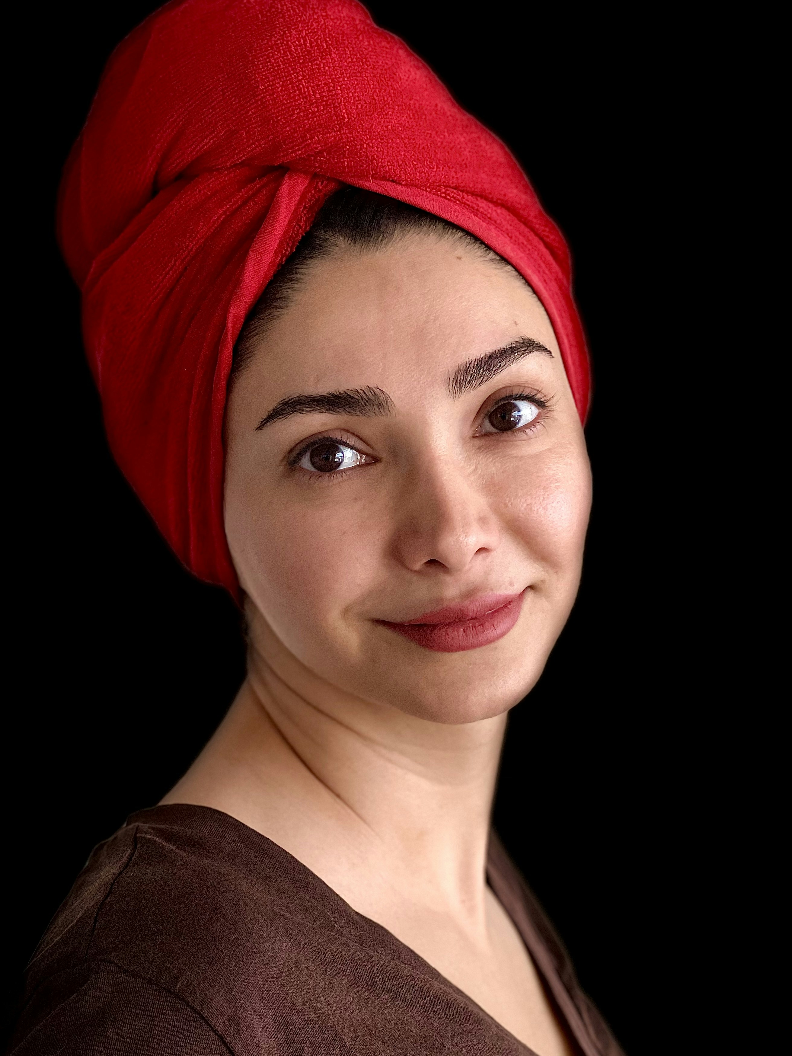 a woman with a red turban on her head