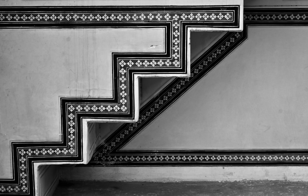 a black and white photo of a stair case