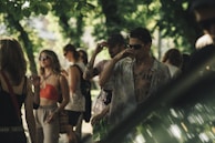 Singles enjoying a relaxed outdoor meetup with greenery and soft lighting in Daytona.