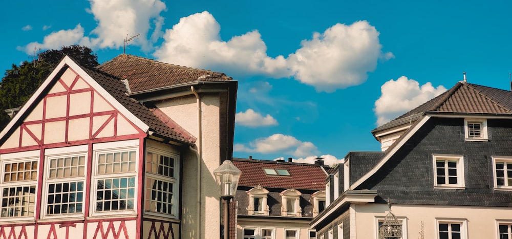 a row of houses with a blue sky in the background