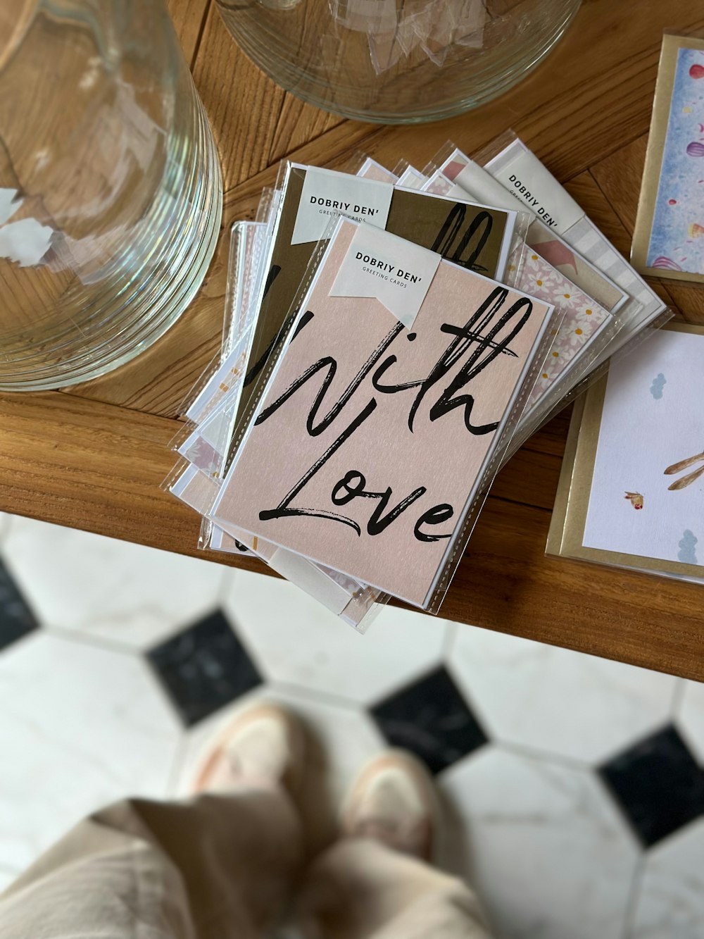 a wooden table topped with lots of cards