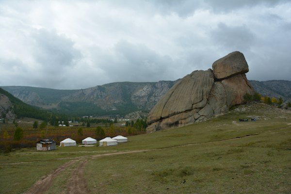 A large rock in the middle of a field — Terelj, Mongolia