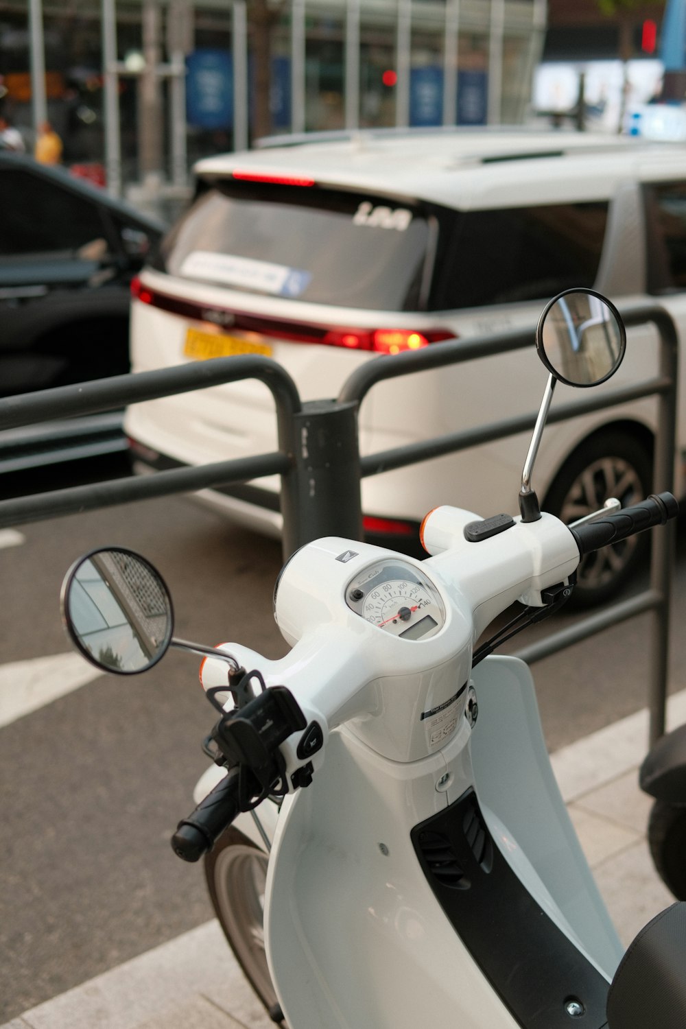 a scooter parked on the side of the road