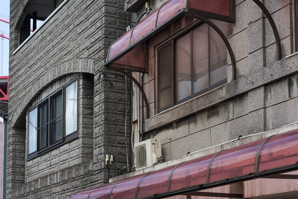 a building with a red awning next to a red fire hydrant