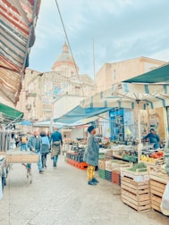 A vibrant street market filled with colorful stalls and diverse foods.