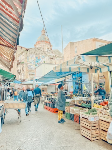 A vibrant street market bustling with locals and colorful stalls.