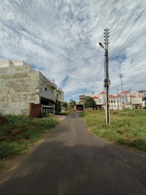 Wide shot of a peaceful suburban street with homes connected by underground fiber optic lines.