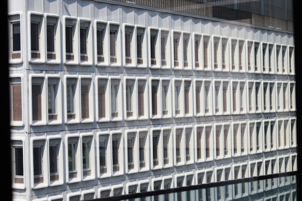 a tall building with many windows and a clock