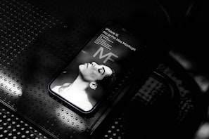 Elegant grayscale image of a digital ad mockup displayed on a smartphone