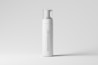 A tall, slender white bottle with a pump cap is centered against a plain light gray background. The bottle's surface is smooth, and it features the text 'MOCKUPFREE.NET' vertically along its side.