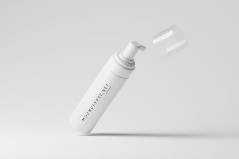 A white pump dispenser bottle with a removable cap, marked with the text 'MOCKUPFREE.NET', is floating against a light gray background. The cap is slightly above the bottle, giving an impression of motion or levitation.