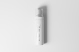 A sleek white bottle with a clear cap, featuring vertical text that reads 'MOCKUPFREE.NET'. The minimalist design highlights its modern and clean aesthetic.