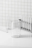 Close-up of durable glassware bearing the labvanta logo on a lab bench.