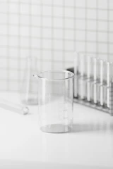 A clean, minimalistic laboratory workspace with test tubes and equipment arranged neatly