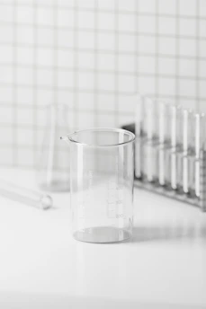 A clean, minimalistic laboratory workspace with test tubes and equipment arranged neatly