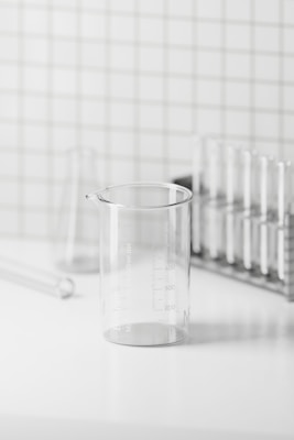 Laboratory glassware arranged neatly on a clean white surface
