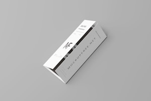 A white tri-fold pamphlet with a minimalist design placed on a light gray background. The pamphlet features bold, black typography with the letters 'MF' prominently displayed. The text 'MOCKUPFREE.NET' is visible, along with some smaller text details. The pamphlet appears sleek and professional.