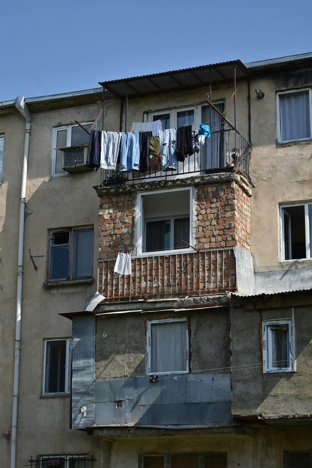 an apartment building with clothes hanging out to dry