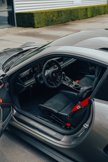 A clean, spacious car interior showing comfortable leather seats and neat details