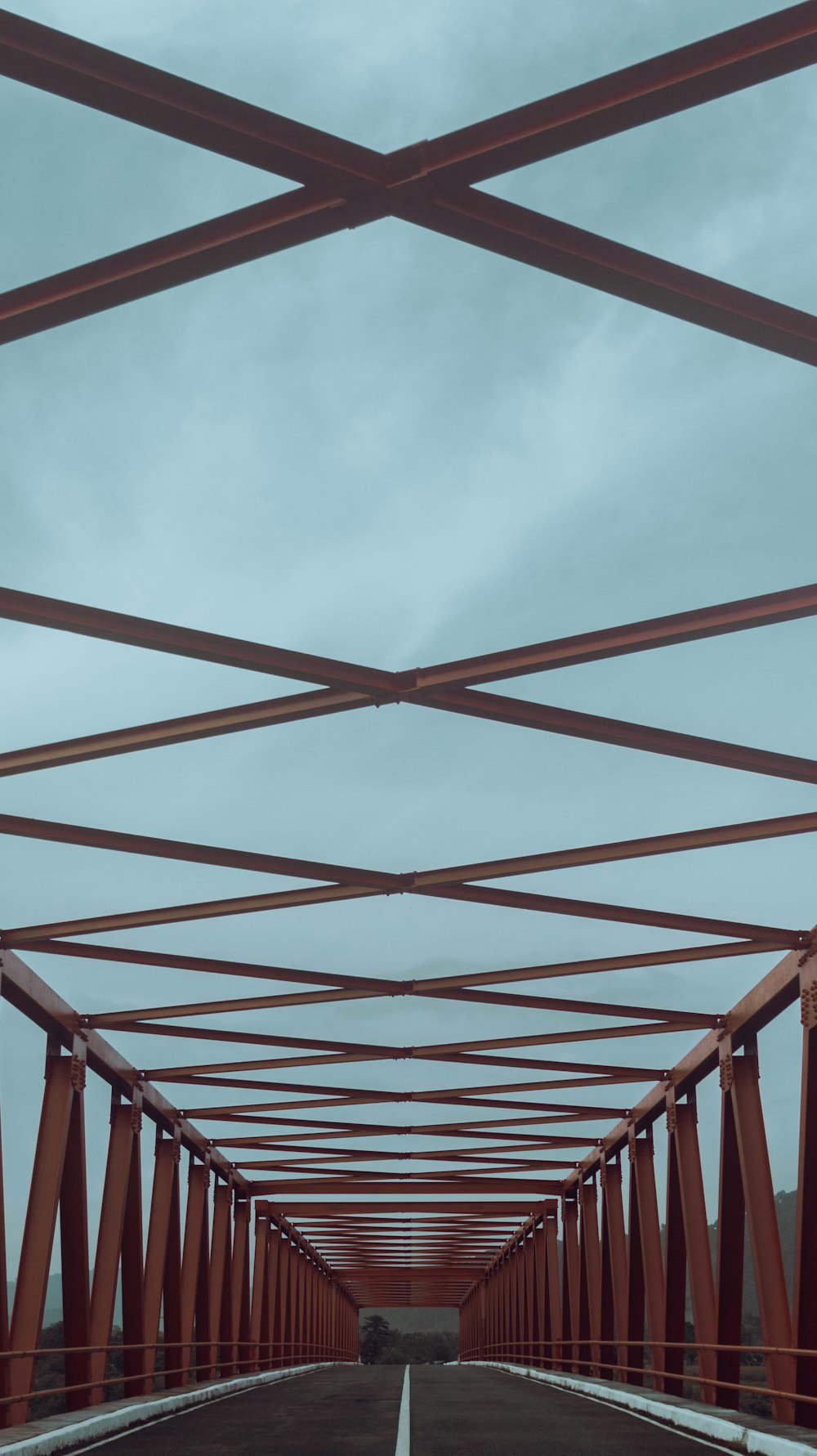 a long bridge that has a sky in the background