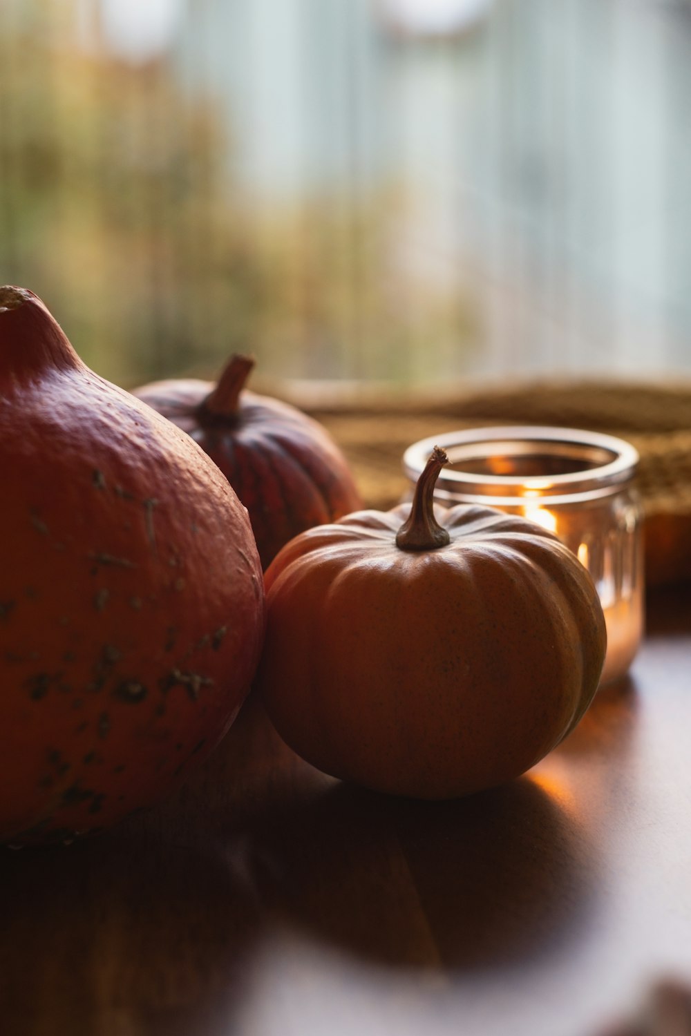 a couple of oranges sitting on top of a wooden table