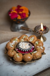 a plate of food on a table with a candle