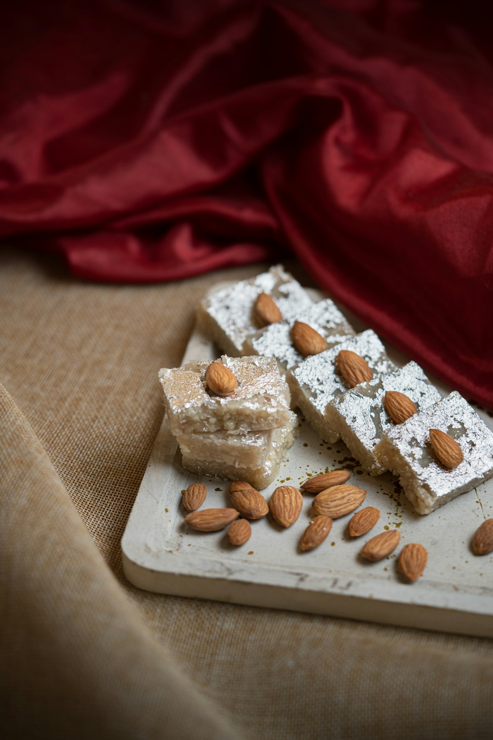 almonds and almond squares on a cutting board