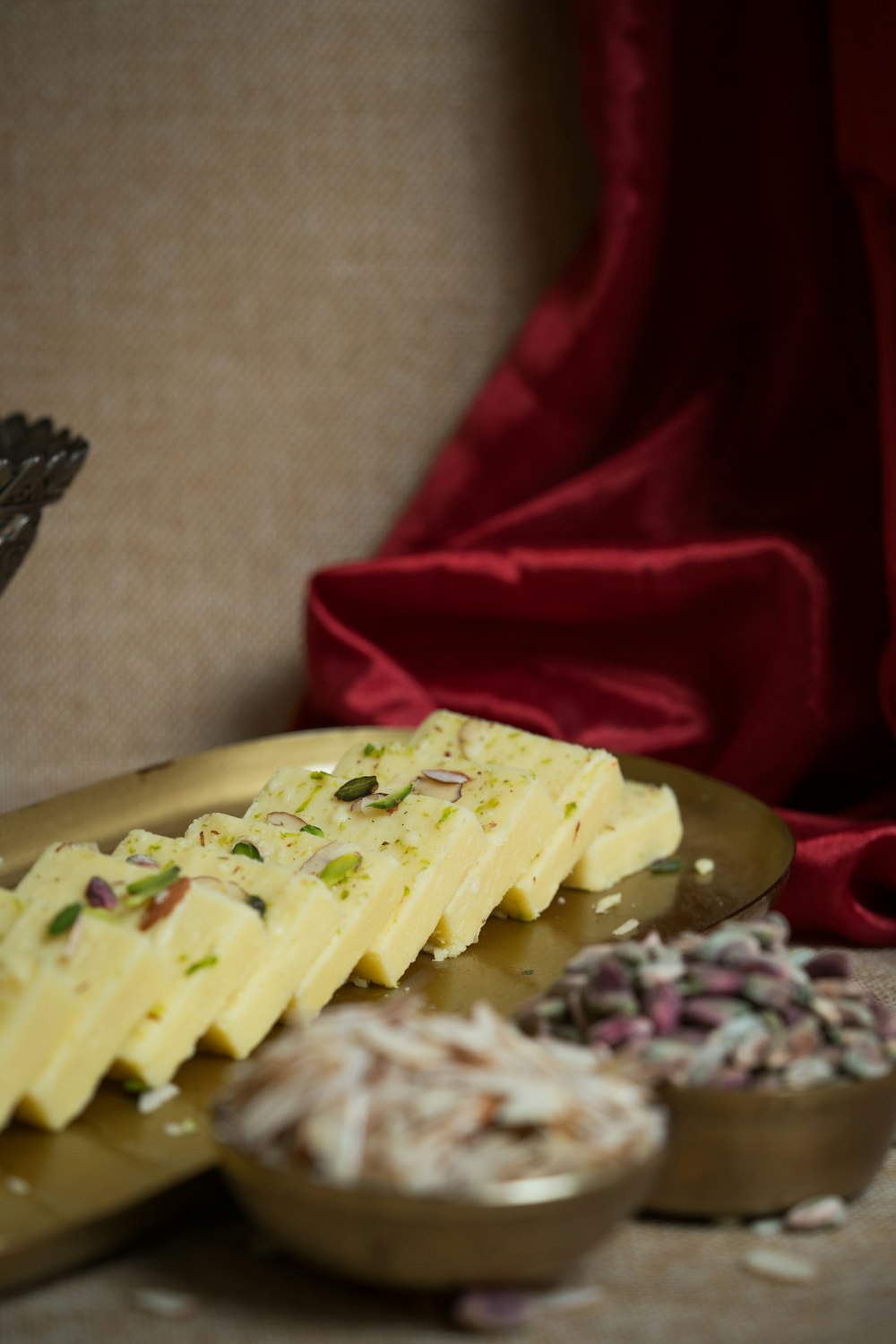 a plate of food on a table with a red cloth