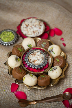 a plate of assorted desserts on a table