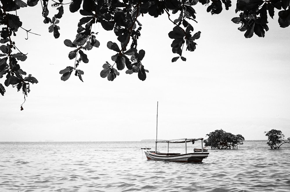 a boat floating on top of a large body of water