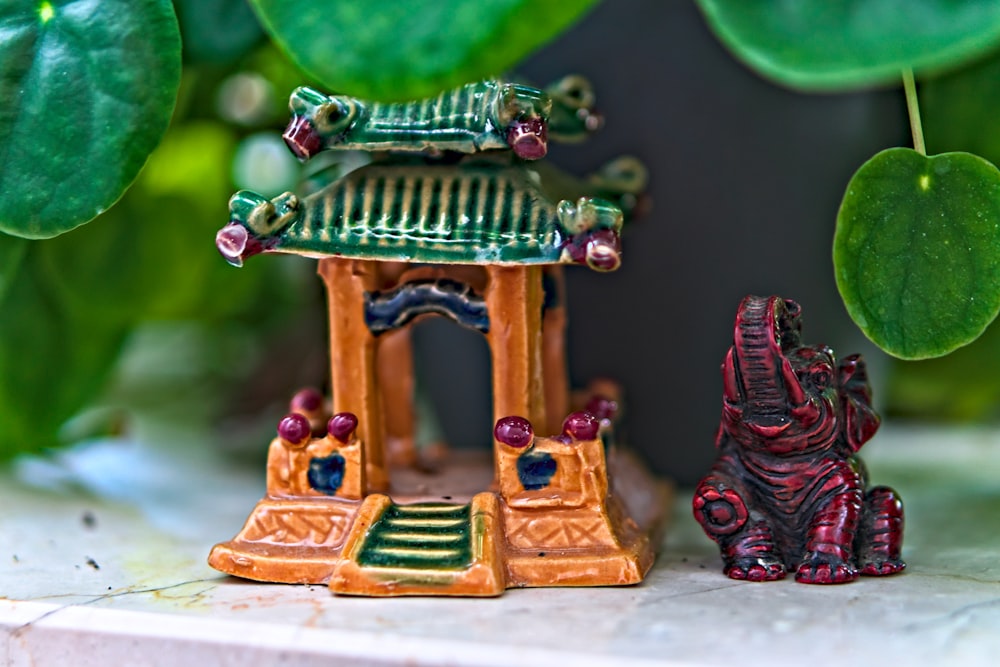 a small figurine of an elephant and a pagoda