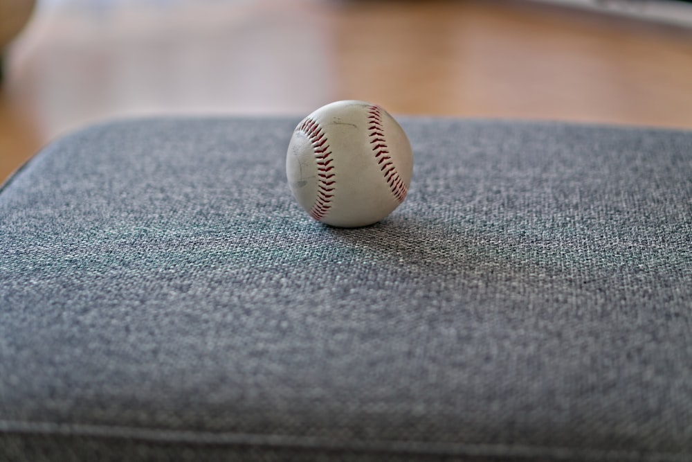 a baseball sitting on top of a chair