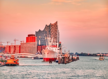 A ship broker negotiating contracts in a bright office overlooking the harbor.