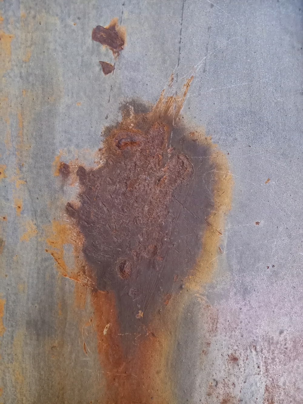a rusted metal surface with a brown substance on it