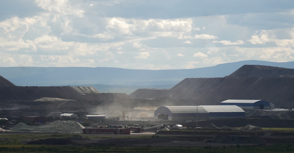 a view of a large open field with mountains in the background