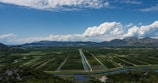 an aerial view of a field with a river running through it
