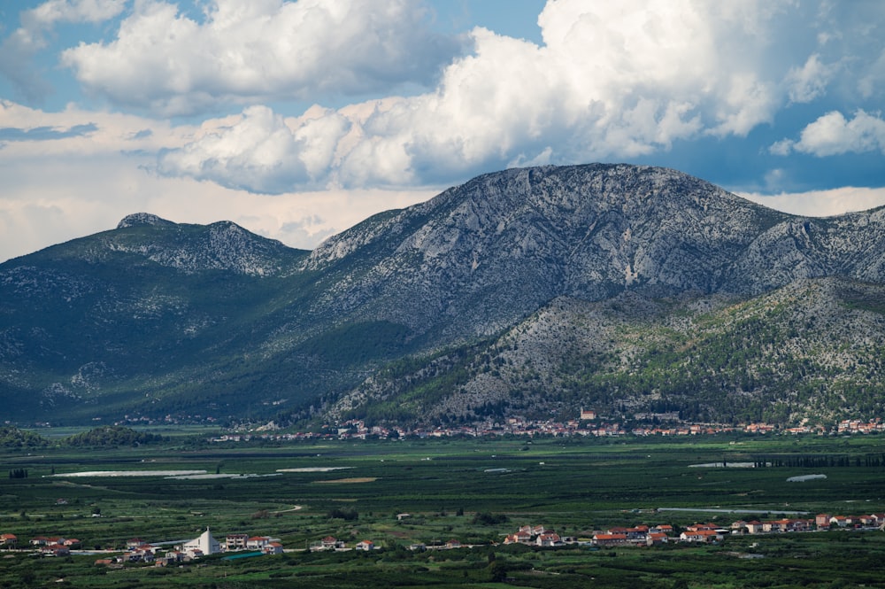 a mountain range with a town in the foreground